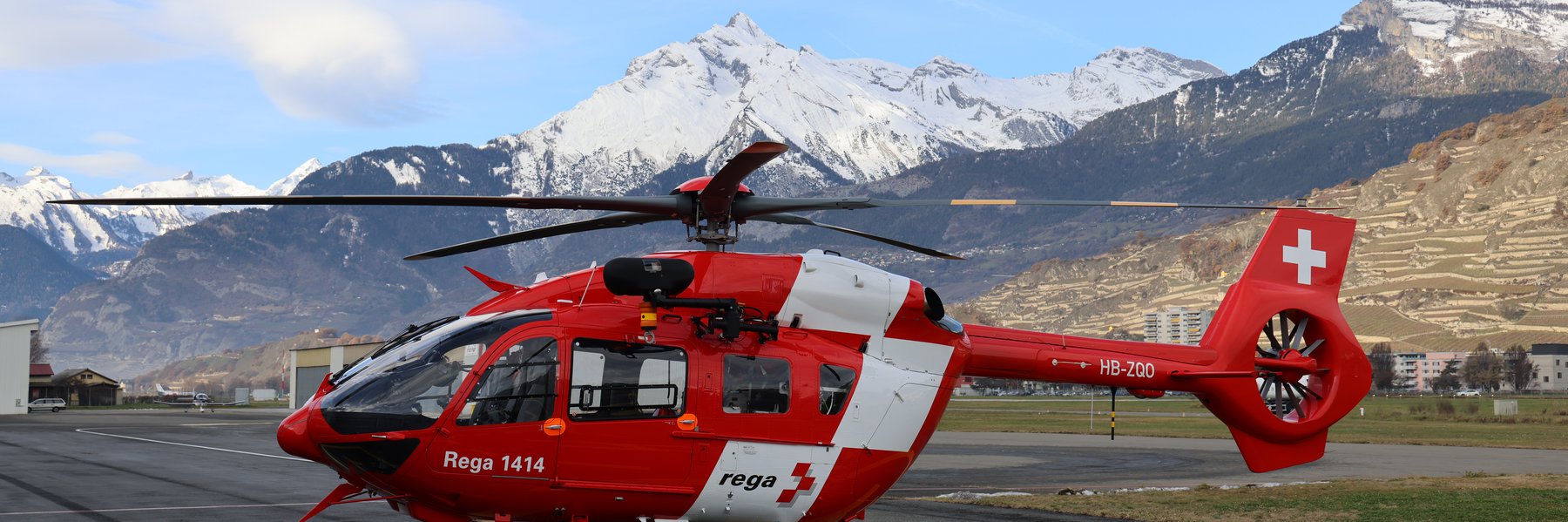 H145 in front of a snow-covered peak