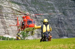 SAC helicopter rescue specialist guiding the rescue helicopter